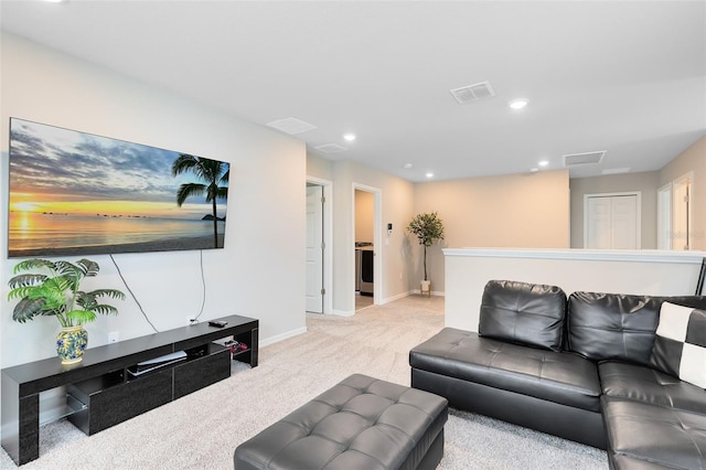 carpeted living room with visible vents, recessed lighting, and baseboards