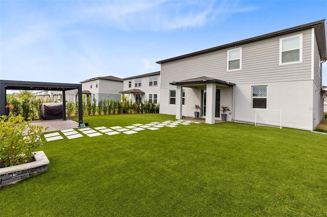 back of property with a patio area and a lawn