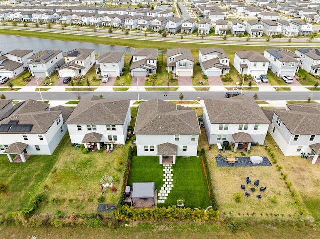 birds eye view of property with a residential view