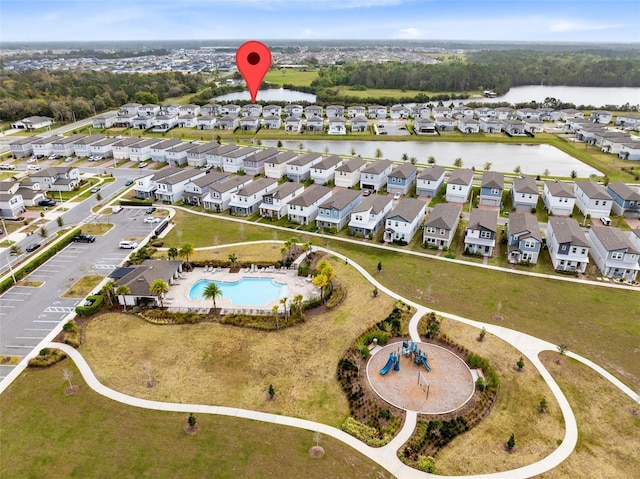 aerial view with a residential view and a water view