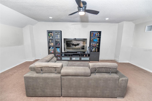 carpeted living area featuring a textured ceiling, ceiling fan, baseboards, recessed lighting, and lofted ceiling
