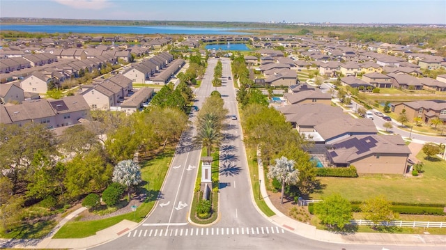 aerial perspective of suburban area featuring a nearby body of water
