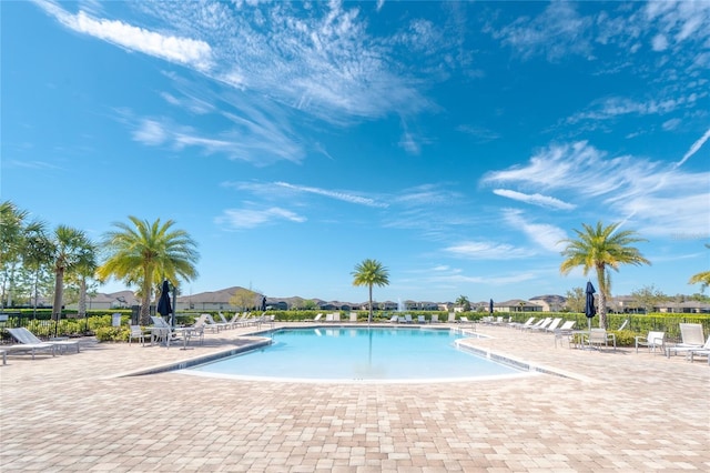 community pool featuring a patio area