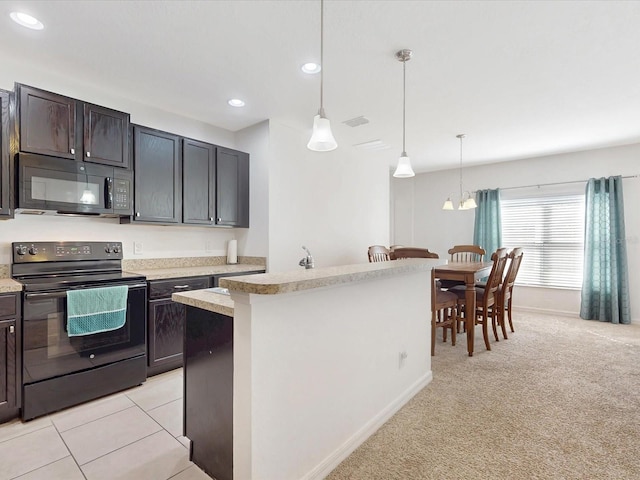 kitchen with pendant lighting, recessed lighting, light colored carpet, light countertops, and black appliances