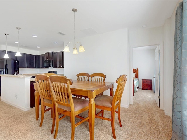 dining space with light carpet, baseboards, visible vents, an inviting chandelier, and recessed lighting