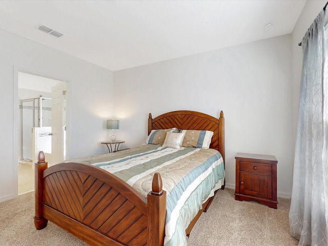 carpeted bedroom featuring visible vents