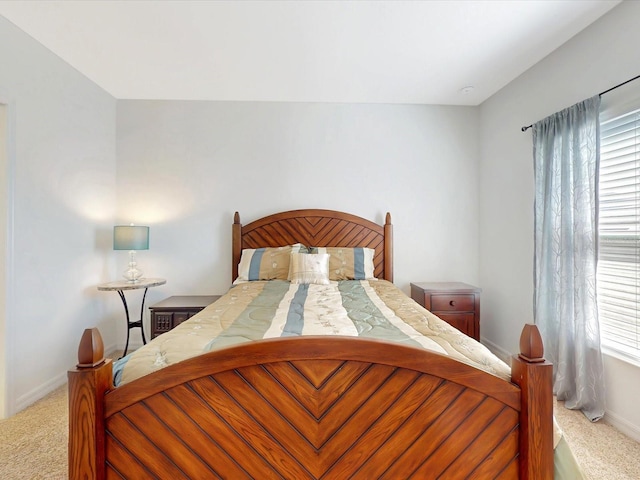 bedroom with carpet floors and baseboards