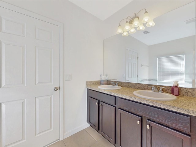 full bathroom featuring double vanity, visible vents, a sink, and tile patterned floors