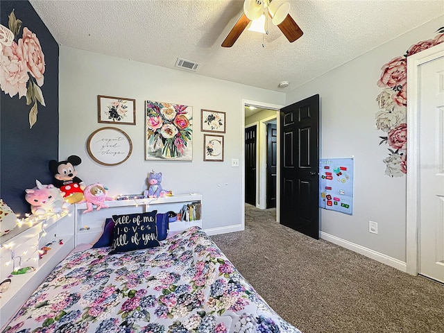 bedroom with carpet floors, visible vents, a ceiling fan, a textured ceiling, and baseboards