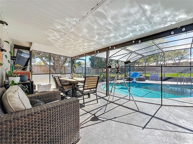 view of pool with a patio, a fenced backyard, a fenced in pool, and a lanai