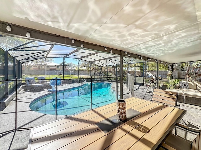 pool featuring a patio area, a fenced backyard, and a lanai