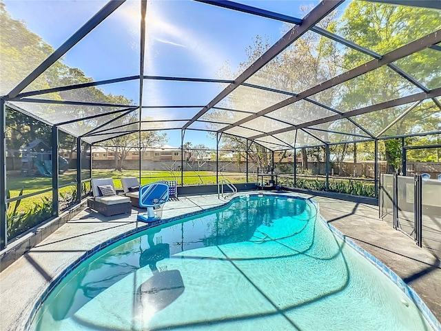 view of swimming pool featuring a lanai, a patio area, a fenced backyard, and a fenced in pool