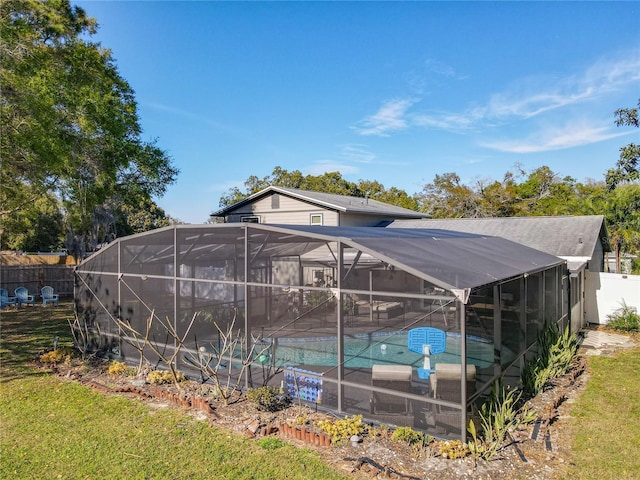 outdoor pool with glass enclosure and fence