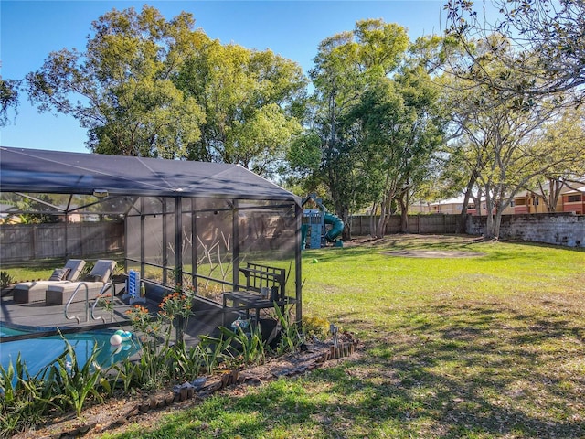 view of yard with a patio area, a lanai, and a fenced backyard