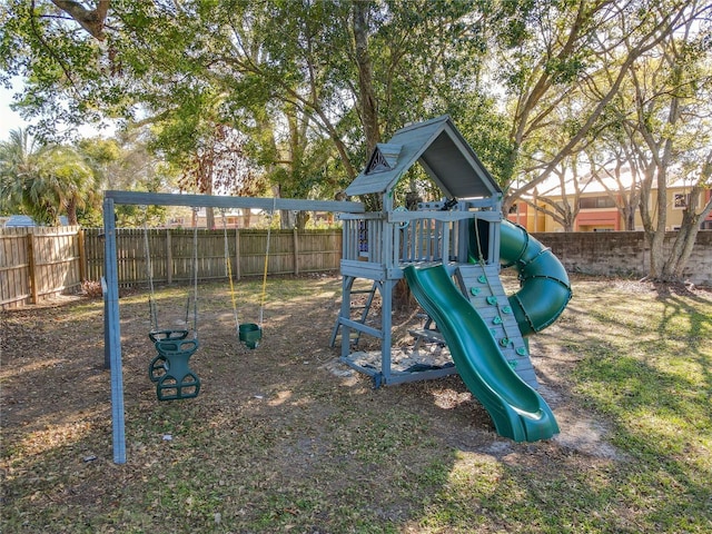 view of jungle gym with fence