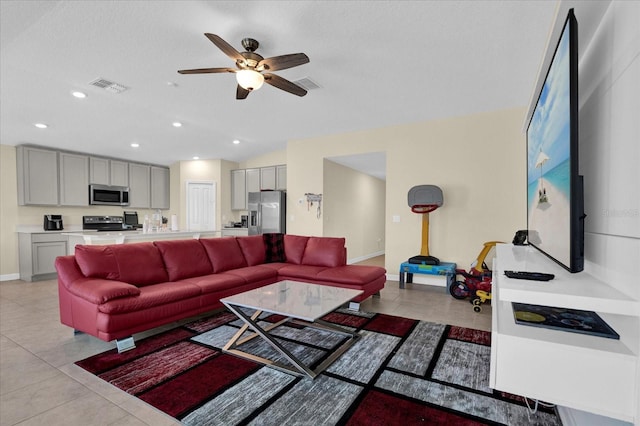 living area featuring recessed lighting, visible vents, light tile patterned flooring, and ceiling fan