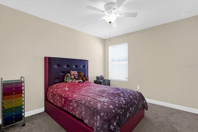 carpeted bedroom featuring baseboards and a ceiling fan