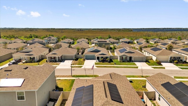 birds eye view of property with a residential view