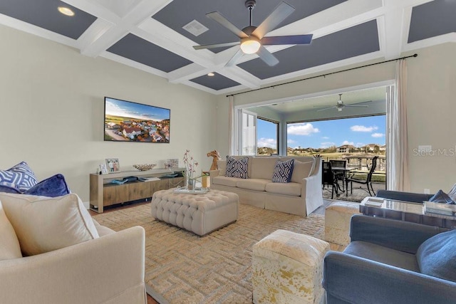 living area featuring beamed ceiling, coffered ceiling, visible vents, and ceiling fan