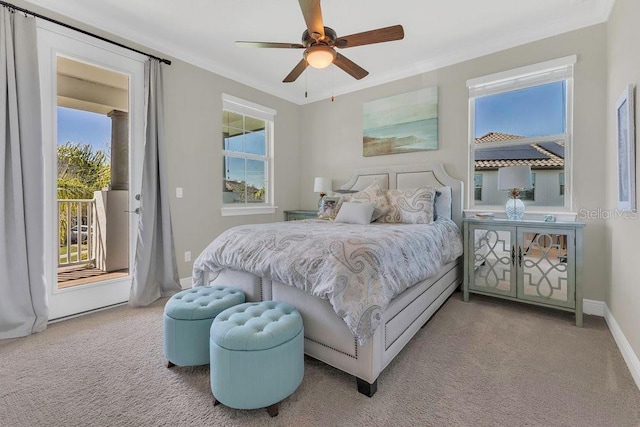 bedroom featuring carpet floors, access to exterior, and crown molding