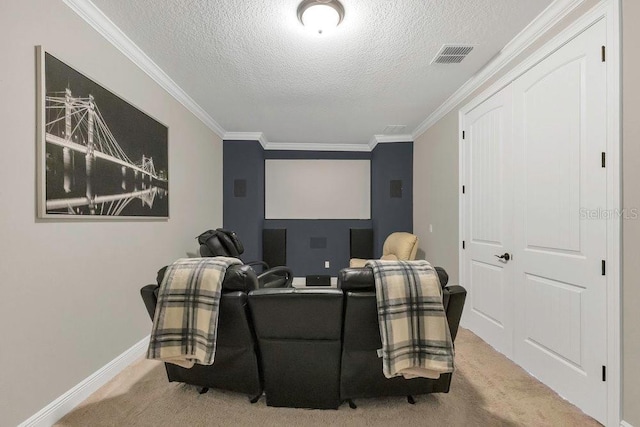 carpeted cinema room featuring a textured ceiling, visible vents, and ornamental molding