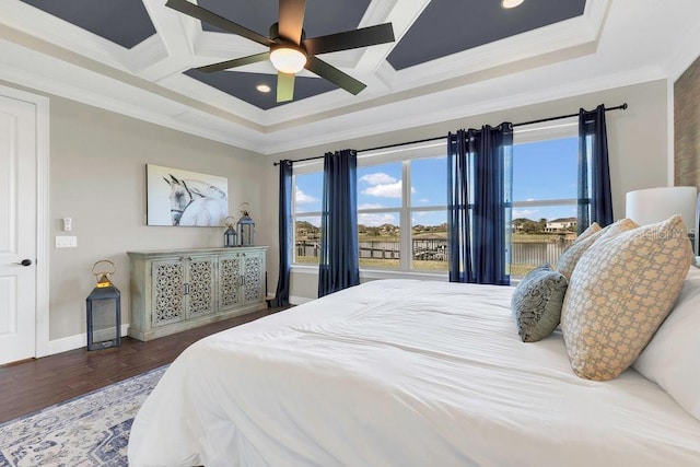 bedroom with multiple windows, coffered ceiling, ornamental molding, and wood finished floors