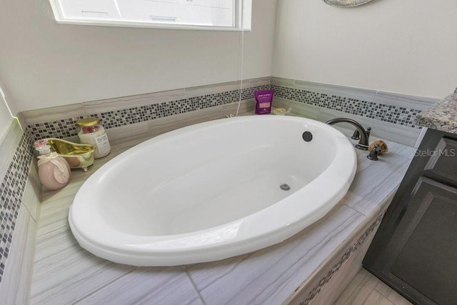 full bath with a garden tub