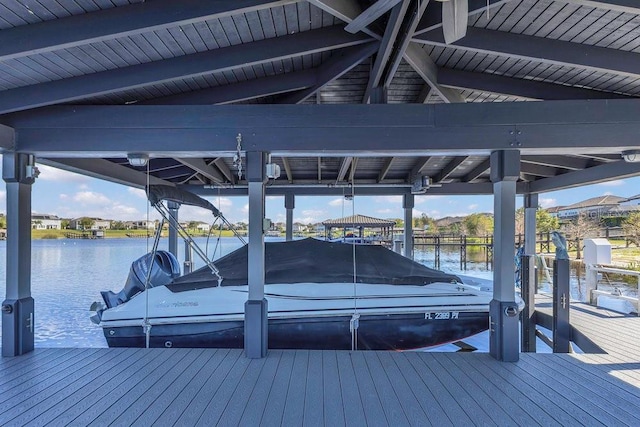 view of dock featuring a water view and boat lift