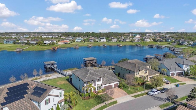 birds eye view of property featuring a residential view and a water view