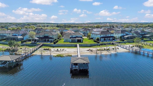 bird's eye view with a residential view and a water view