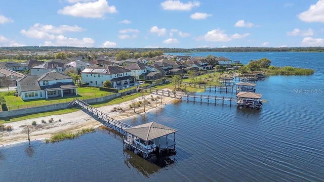 bird's eye view featuring a residential view and a water view