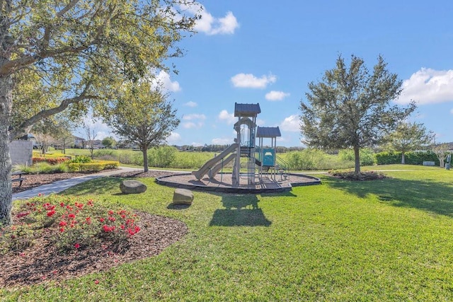 community jungle gym with a yard