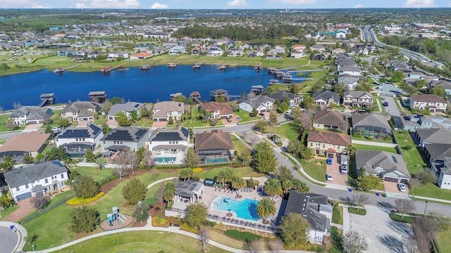 birds eye view of property featuring a residential view and a water view