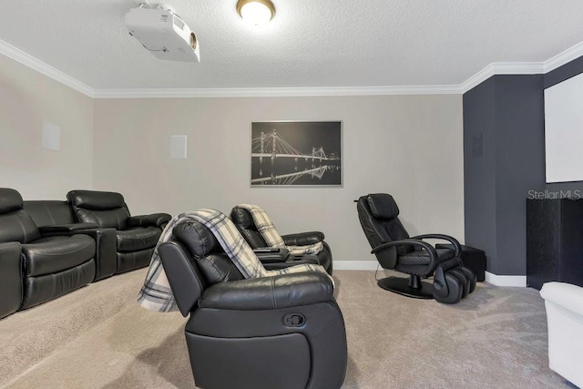 carpeted home theater with a textured ceiling, baseboards, and ornamental molding