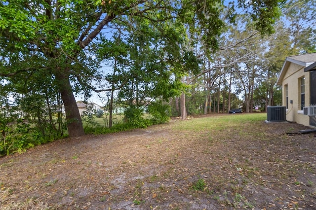 view of yard featuring central AC unit