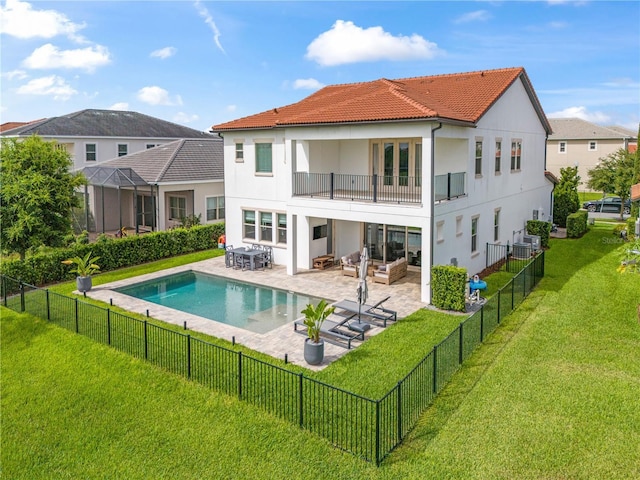 back of property featuring an outdoor living space, fence, a balcony, and a patio