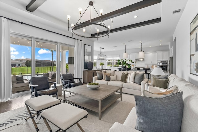 8025 Topsail Pl, Winter Garden, FL 34787 - living room with a chandelier, recessed lighting, light wood-style flooring, and beamed ceiling