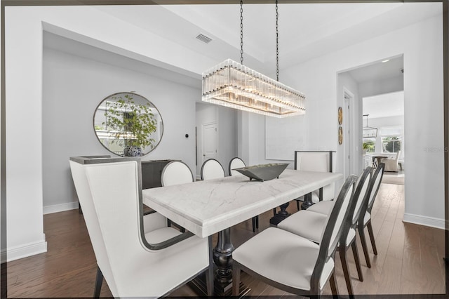 8025 Topsail Pl, Winter Garden, FL 34787 - dining space with a chandelier, baseboards, and dark wood-type flooring