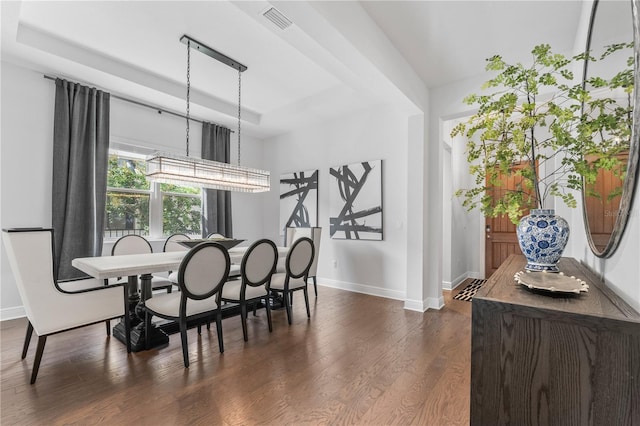 8025 Topsail Pl, Winter Garden, FL 34787 - dining space with baseboards, dark wood-type flooring, and a chandelier