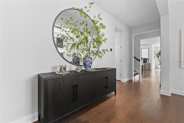 8025 Topsail Pl, Winter Garden, FL 34787 - corridor with dark wood-type flooring, baseboards, and stairway
