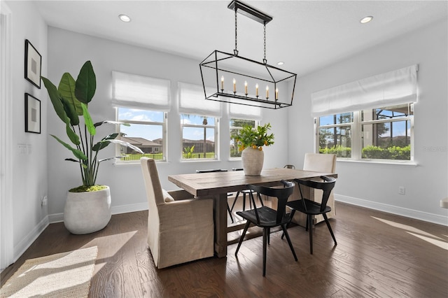 8025 Topsail Pl, Winter Garden, FL 34787 - dining area featuring dark wood-type flooring, baseboards, recessed lighting, and a chandelier