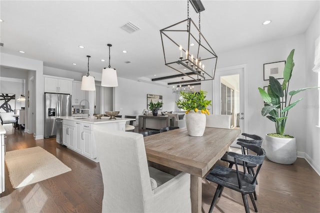 8025 Topsail Pl, Winter Garden, FL 34787 - dining area with recessed lighting, dark wood finished floors, baseboards, and a chandelier