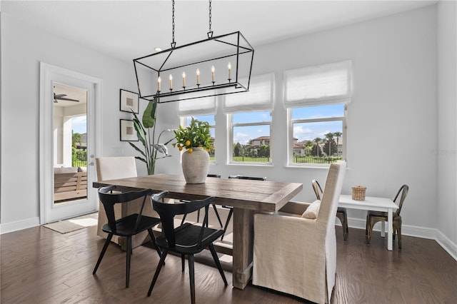 8025 Topsail Pl, Winter Garden, FL 34787 - dining area with baseboards and dark wood-style flooring