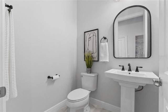 8025 Topsail Pl, Winter Garden, FL 34787 - bathroom featuring toilet and baseboards