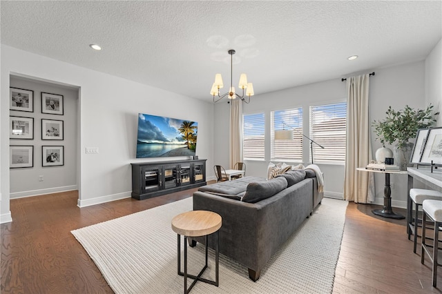 8025 Topsail Pl, Winter Garden, FL 34787 - living area featuring wood finished floors, a chandelier, a textured ceiling, recessed lighting, and baseboards