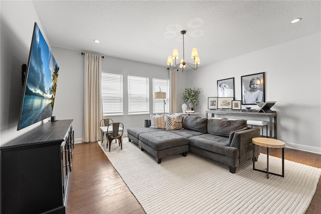 8025 Topsail Pl, Winter Garden, FL 34787 - living area featuring a chandelier, a textured ceiling, dark wood finished floors, baseboards, and recessed lighting
