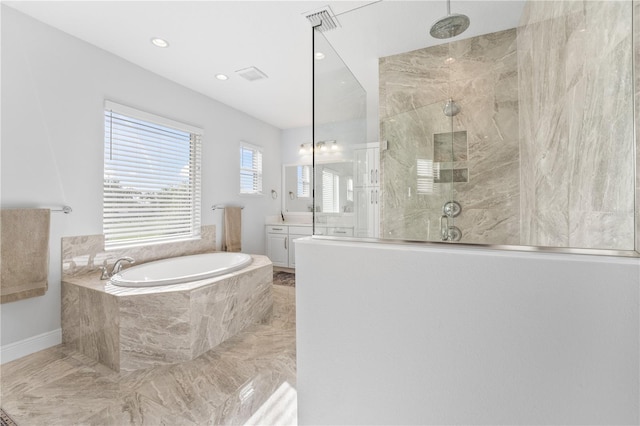 8025 Topsail Pl, Winter Garden, FL 34787 - full bathroom with marble tiled floors, vanity, a bath, walk in shower, and recessed lighting