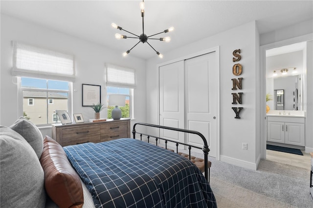 8025 Topsail Pl, Winter Garden, FL 34787 - bedroom with a chandelier, carpet floors, a sink, a closet, and baseboards