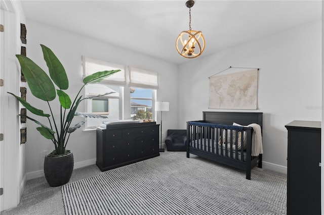 8025 Topsail Pl, Winter Garden, FL 34787 - carpeted bedroom with a chandelier, baseboards, and a crib