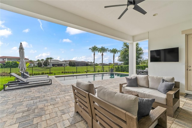 8025 Topsail Pl, Winter Garden, FL 34787 - fenced backyard with outdoor lounge area, a patio, a ceiling fan, and a residential view